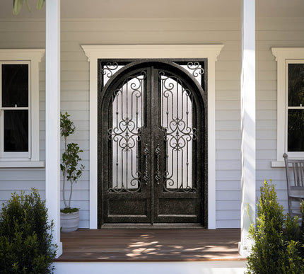decorative iron exterior double door with intricate scrollwork and kickplate