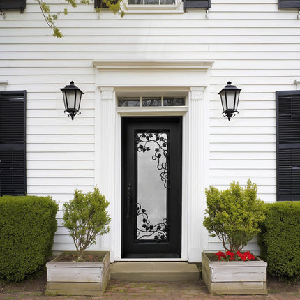 Black wrought iron front door with decorative scrollwork design